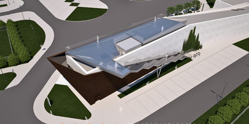 Wizualizacja tarasu widokowego na dachu Centrum Obsługi Turystów w Brzezince. Nowoczesna, geometryczna konstrukcja z przeszklonymi barierami pozwala odwiedzającym podziwiać z góry teren byłego obozu Auschwitz II-Birkenau. Widać schody prowadzące na taras, minimalistyczną bryłę budynku oraz otaczające go alejki i zieleń.