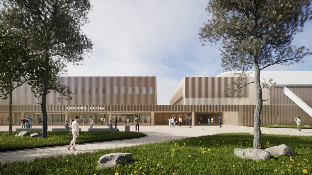 Wizualizacja nowej hali lodowej w Oświęcimiu – nowoczesny kompleks sportowy z jasną, drewnianą elewacją, przestronnym placem wejściowym i zielenią, po którym poruszają się mieszkańcy i sportowcy.